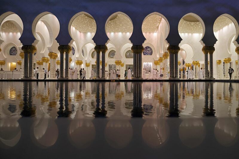 Emiratis leave after performing a funeral prayer for President Sheikh Khalifa at the Sheikh Zayed Grand Mosque in Abu Dhabi. AFP