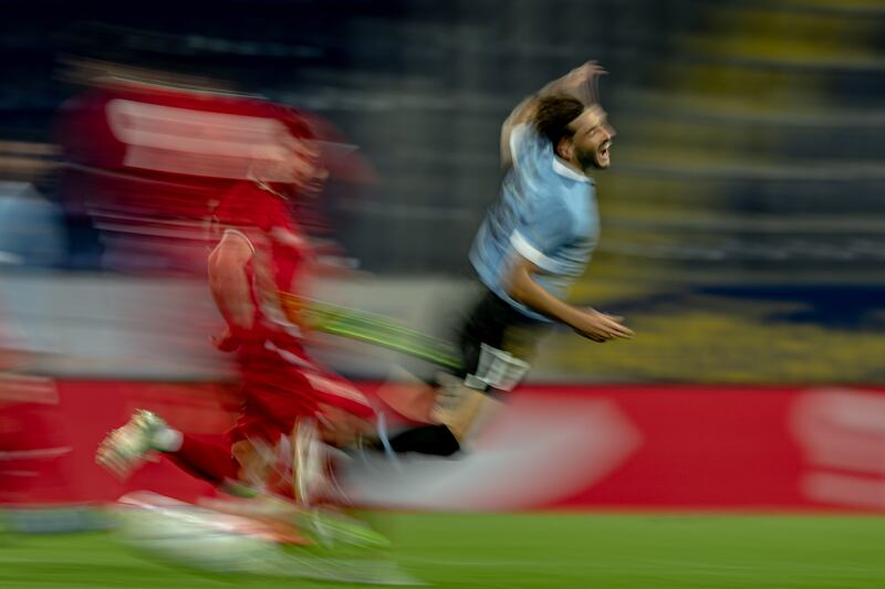 Matias Vina of Uruguay, right, during the international football friendly match between Iran and Uruguay in Sankt Polten, Austria. Iran won by a 78th minute goal from Mehdi Taremi. EPA