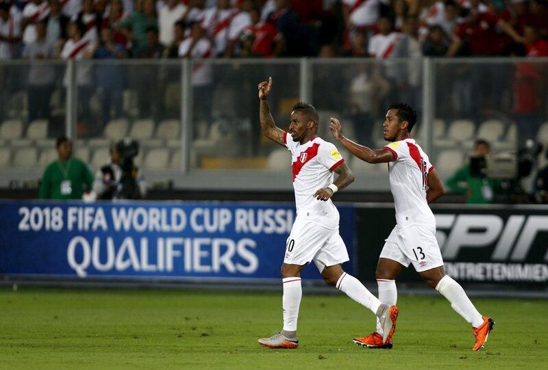 Peru's Jefferson Farfan, left, celebrates after scoring during their 2018 World Cup qualifying soccer match against Paraguay. Mariana Bazo / Reuters 
