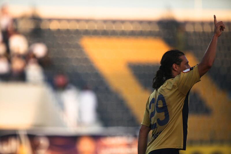 Dubai, UAE, October 10, 2012:

Richard Porta, Dubai's pony-tailed striker, is the subject of a player profile for the sports section of The National.
He is seen here on the night his squad lost to Al Ain. Here, he celebrates aftyer scoring a goal.



Lee Hoagland/The National