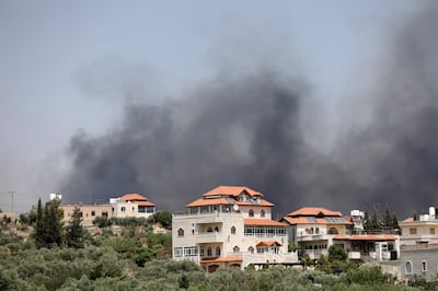 Smoke rises from the Palestinian town Turmus Aya, next to the Israeli settlement of Eli in the West Bank. EPA 