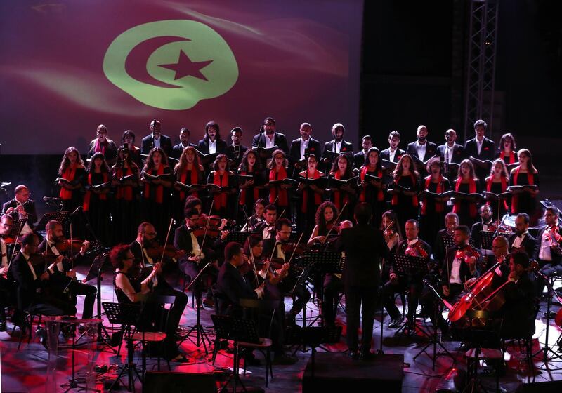 Members of the Tunisian Symphony Orchestra perform during a concert conducted by Tunisian maestro, Mohamed Bouslama during the celebration of the 63rd anniversary of the Feast of the Republic, in Hammamet,Tunisia.  EPA