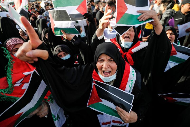 Iraqi women take part in a march in the capital Baghdad's Tahrir square on the 73rd anniversary of the Nakba. AFP