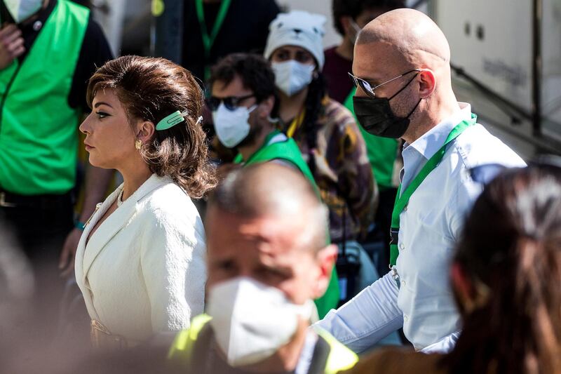 Lady Gaga, left, arrives on the set of the film 'House of Gucci,' set up in the 'Zita Fabiani' fashion store at the Talenti district in Rome, Italy. EPA