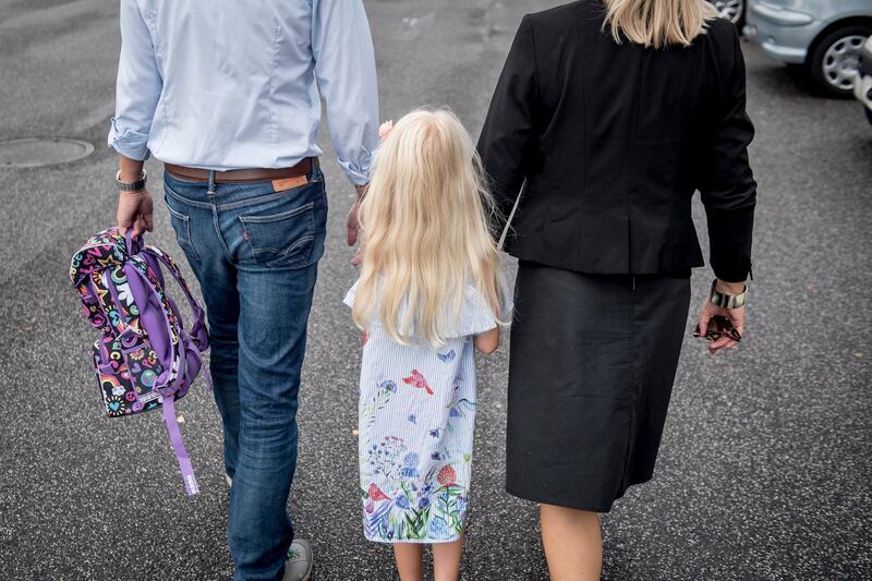 epa06949104 Sofie Bjerrum is accompanied by her parents on her first day of school, in Traellerup, near Roskilde, Denmark, 14 August 2018. Sofie will start in Class 0 in Traellerup School. Mid August marks the time every year when 6 year old Danish children all over the country have their first day of school at 'Boernehaveklasse' (Kindergarten class). Traditonally, parents accompany the pupils on this day and stay to be introduced to each other and to the teachers.  EPA/MADS CLAUS RASMUSSEN MODEL RELEASED. ATTENTION: THIS IMAGE IS PART OF A PHOTO SET. DENMARK OUT