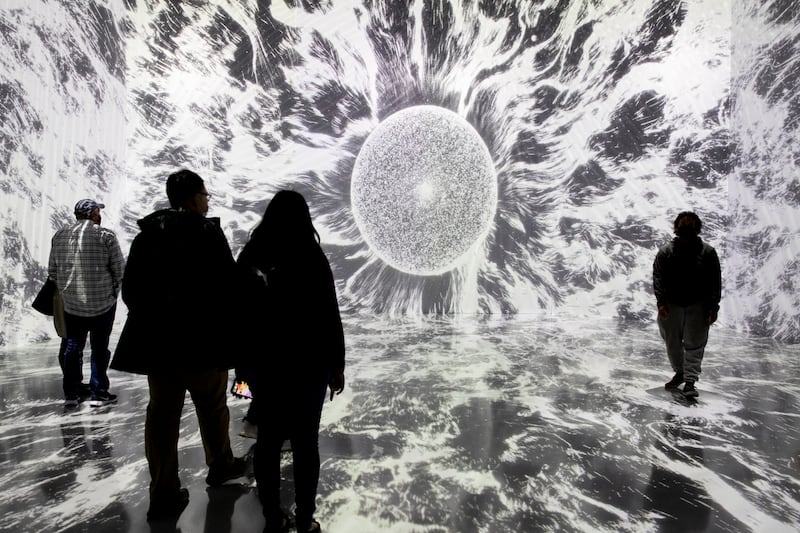 Visitors at an exhibition called 'Life of a Neuron' in Washington in November 2021. EPA