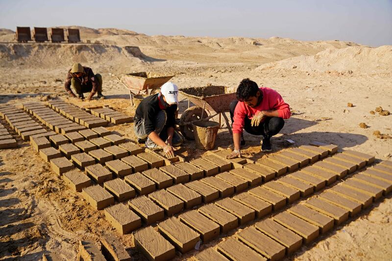 Workers take part in the German-Iraqi archaeological dig in Iraq's Muthanna province.