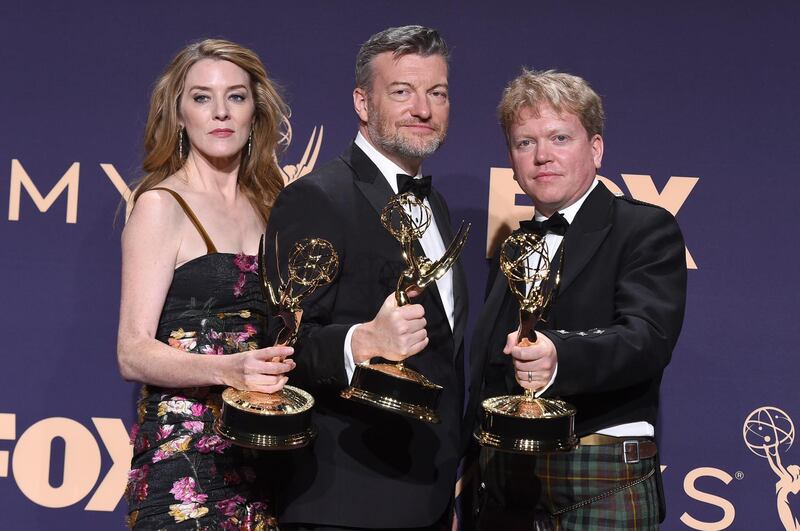 Annabel Jones, from left, Charlie Brooker and Russell McLean poses in the press room with the award for outstanding television movie for 'Black Mirror: Bandersnatch'. AP