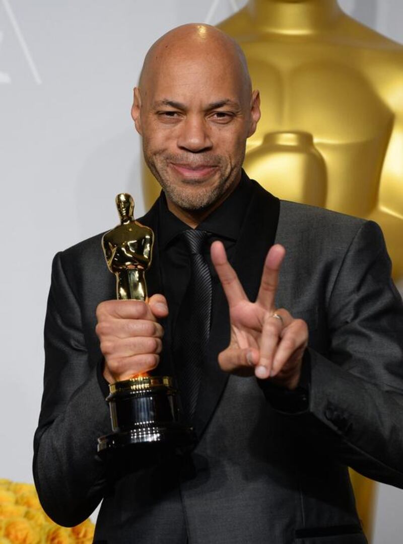 John Ridley poses in the press room with the award for best adapted screenplay of the year for 12 Years a Slave. AP