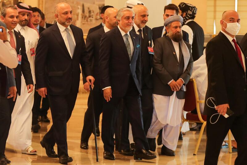 Abdullah Abdullah arrives at the talks venue with the government delegation. AFP