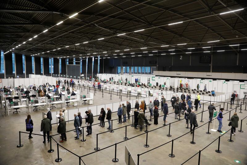 People queue on Christmas Day for booster shots in Rotterdam, the Netherlands. EPA