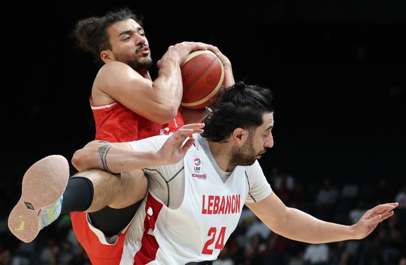 Egypt (in red) take on Lebanon (white) during the International Basketball Week in Abu Dhabi on August 17 2023. EPA