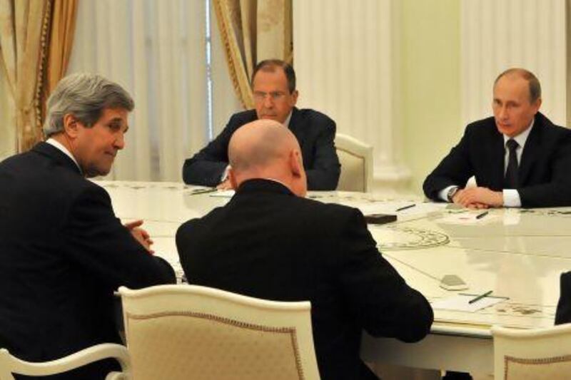 Russian president Vladimir Putin (right) and the US secretary of state, John Kerry, (left)  at the Kremlin.