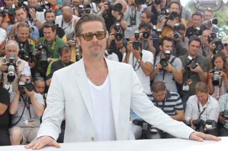 US actor Brad Pitt poses during the photocall of "The Tree of Life" presented in competition at the 64th Cannes Film Festival on May 16, 2011 in Cannes.  AFP PHOTO / VALERY HACHE

 *** Local Caption ***  009764-01-08.jpg