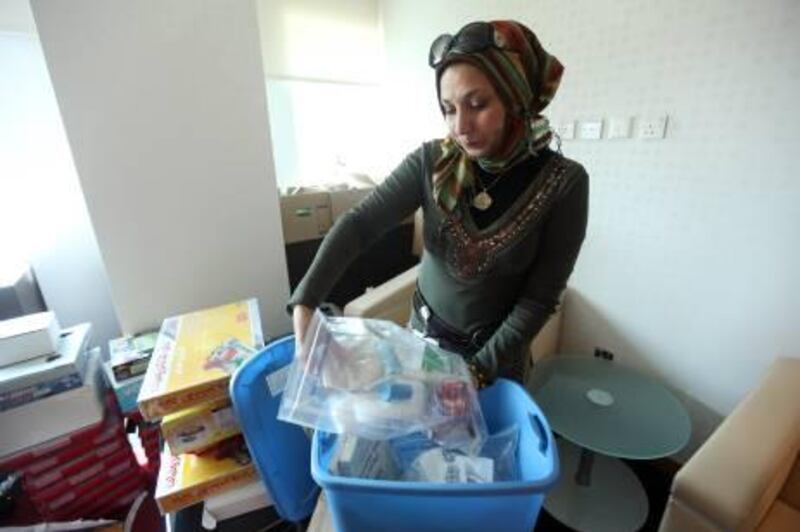 October 4, 2010/  Abu Dhabi / Abeer Gibril a Science Instructor and Project Coordinator with the Emirates Foundation looks through various science kits the Emirates Foundation with use as part of the Science Express Bus that will start touring schools in Abu Dhabi to help get children interested in science October 4, 2010. (Sammy Dallal / The National)
