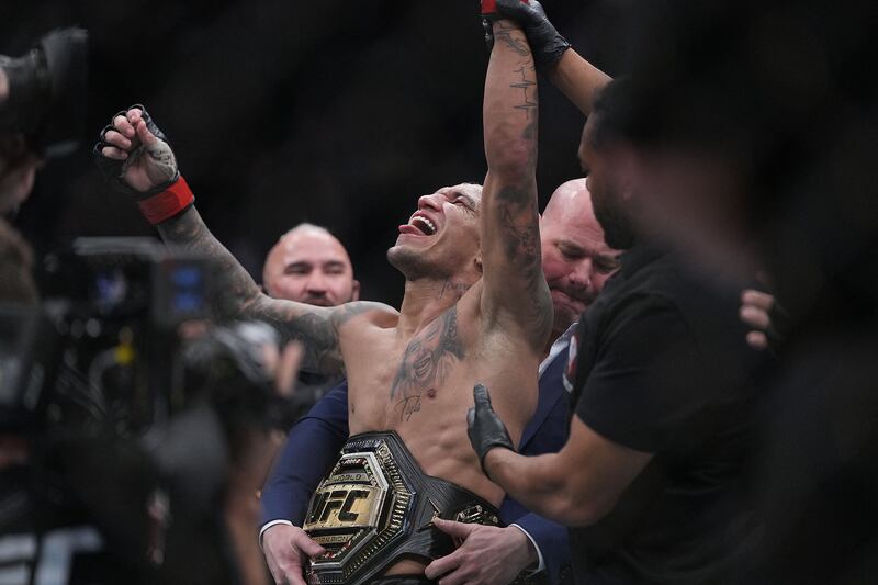 Charles Oliveira celebrates his victory by submission against Dustin Poirier at UFC 269. Reuters