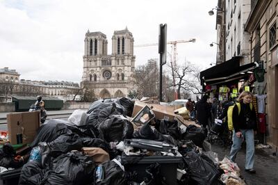 Mounds of household waste litter the pavements near Notre-Dame cathedral on Monday. AFP