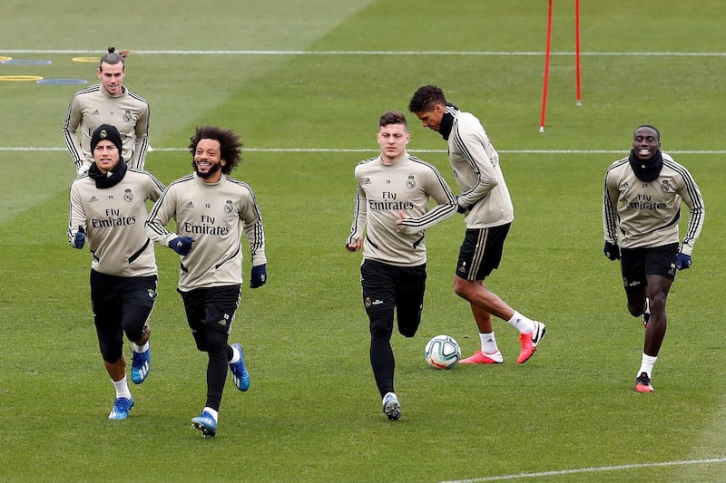 Real Madrid's players James Rodriguez (front), Gareth Bale, Marcelo, Luka Jovic, Raphael Varane and Ferland Mendy