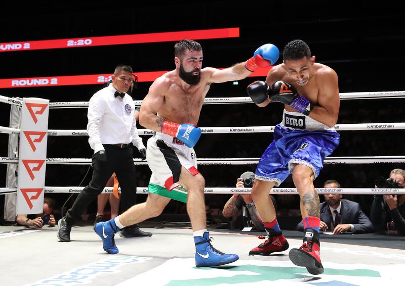 Jono Carroll (white shorts) takes on Aelio Mesquita (blue) in a Super Featherweight / Lightweight bout at the Coca Cola Arena, Dubai. Chris Whiteoak/ The National