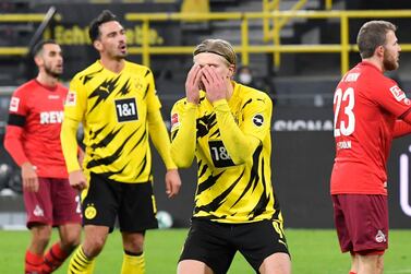 Dortmund's Erling Haaland, center, reacts during the German Bundesliga soccer match between Borussia Dortmund and 1.FC Cologne in Dortmund, Germany, Saturday, Nov. 28, 2020. (AP Photo/Martin Meissner, Pool)