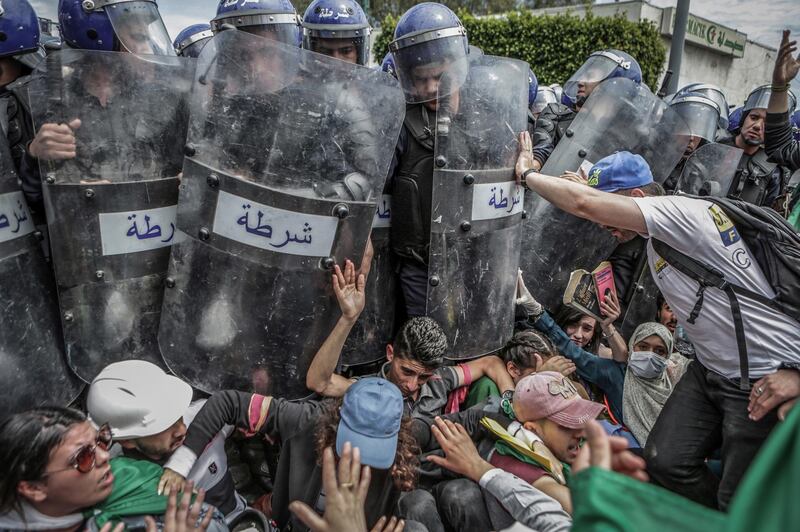 A photo by Farouk Batiche showing students scuffle with riot police during an anti-government demonstration in Algiers, Algeria, on May 21, 2019, won first prize in the Spot News Singles category. Farouk Batiche / dpa