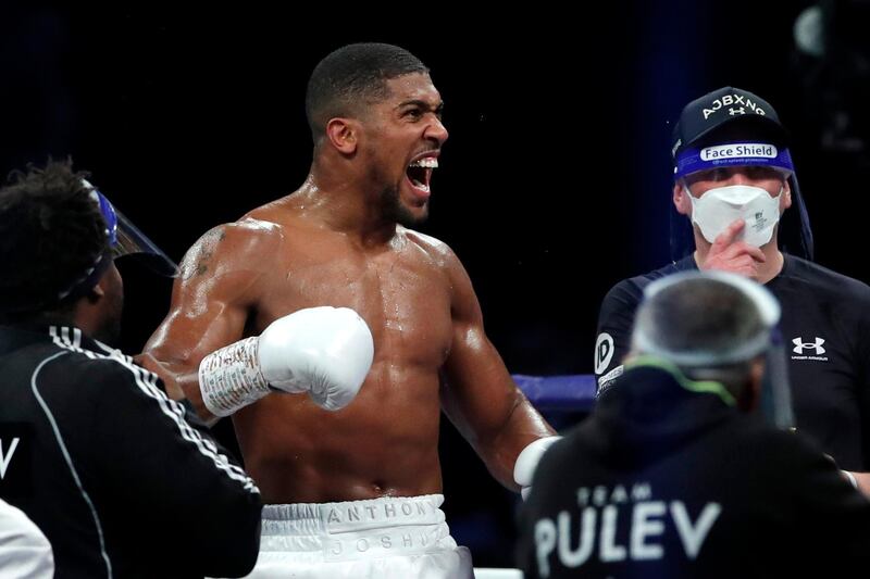 Anthony Joshua celebrates his victory.