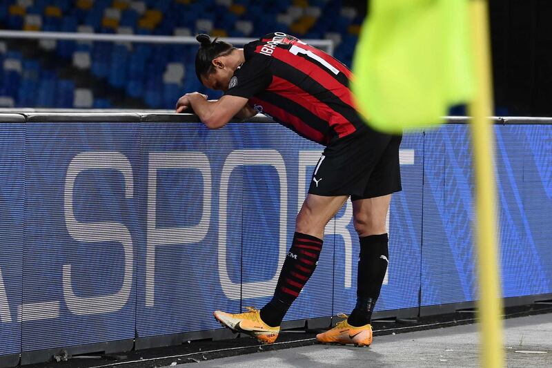 Zlatan Ibrahimovic leans on the advertising hoardings after sustaining a thigh muscle strain. AFP