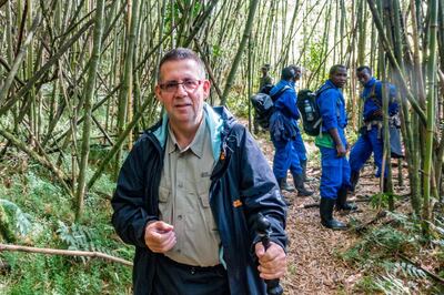 Dr Harold Vanderschmidt trekking through the forest. Courtesy of Dr Harold Vanderschmidt 