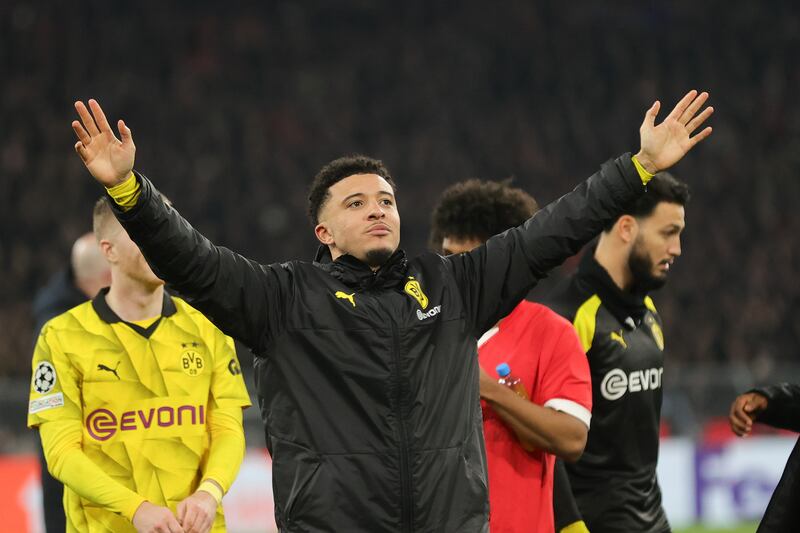 Jadon Sancho celebrates after Borussia Dortmund's Champions League last-16 win over PSV Eindhoven on March 13, 2024. EPA