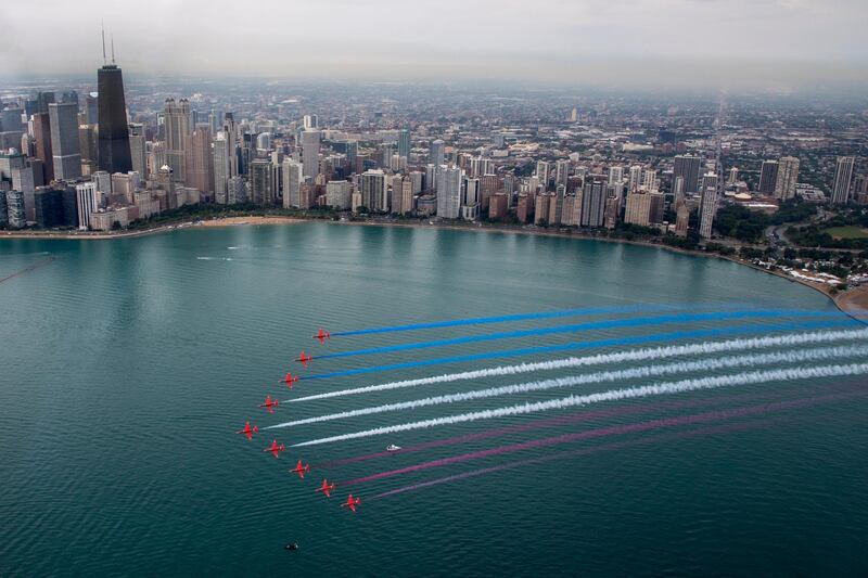 The Royal Air Force Aerobatic Team, The Red Arrows perform a flypast with the skyline of Chicago, USA in the background.    EPA