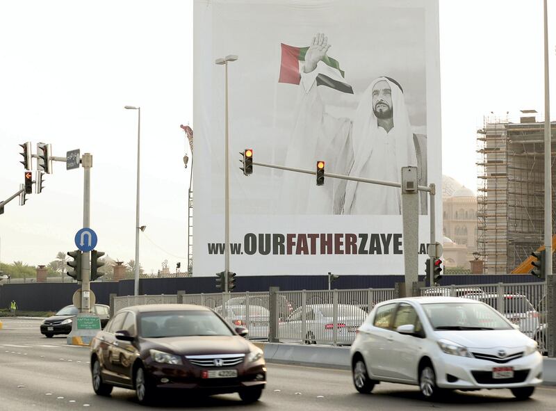 Abu Dhabi, United Arab Emirates, August 06, 2017: Our father Zayed poster with traffic going past on Thursday, Aug. 06, 2017, The Corniche, Abu Dhabi. Chris Whiteoak The National