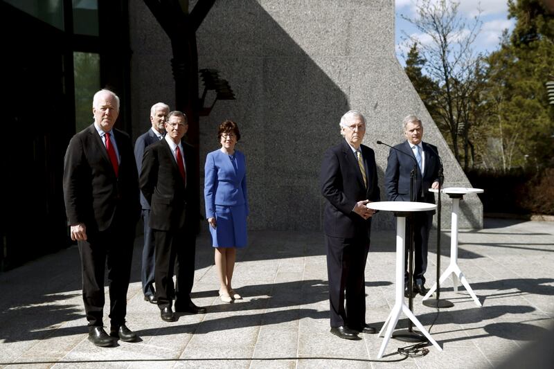 Finland's President Sauli Niinisto and US Senate Minority Leader Mitch McConnell answer questions from the media as Republican senators John Barrasso, Susan Collins and John Cornyn and US new ambassador to Finland Douglas Hickey  listen, after a meeting at the president's official residence in Helsinki. Reuters