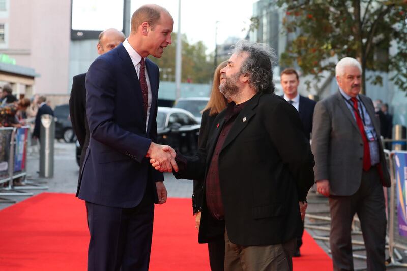 Britain's Prince William, Duke of Cambridge shakes hands with New Zealand film maker Peter Jackson as he attends the world premiere of Peter Jackson's film "They Shall Not Grow Old" during the BFI London Film Festival in London, Britain October 16, 2018. Daniel Leal-Olivas/Pool via REUTERS