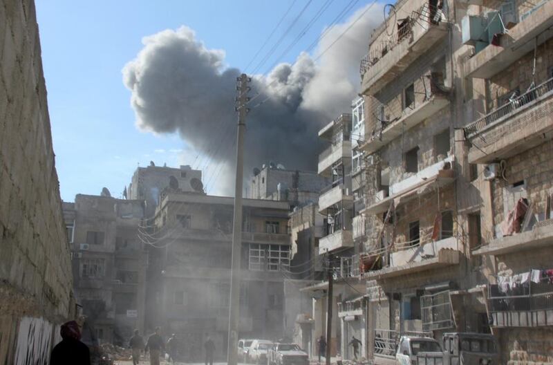 Smoke billows from a regim airstrike in the northern Syrian city of Aleppo on Friday. Nearly 1,900 people have been killed in Syria while peace talks were held in Switzerland from January 22, the Syrian Observatory for Human Rights said. Medo Halab / AFP