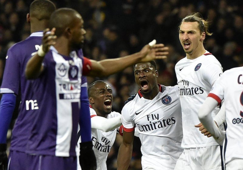 Paris Saint-Germain's Zlatan Ibrahimovic celebrates with Serge Aurier after scoring against Toulouse in Ligue 1 last weekend. Pascal Pavani / AFP / January 16, 2016