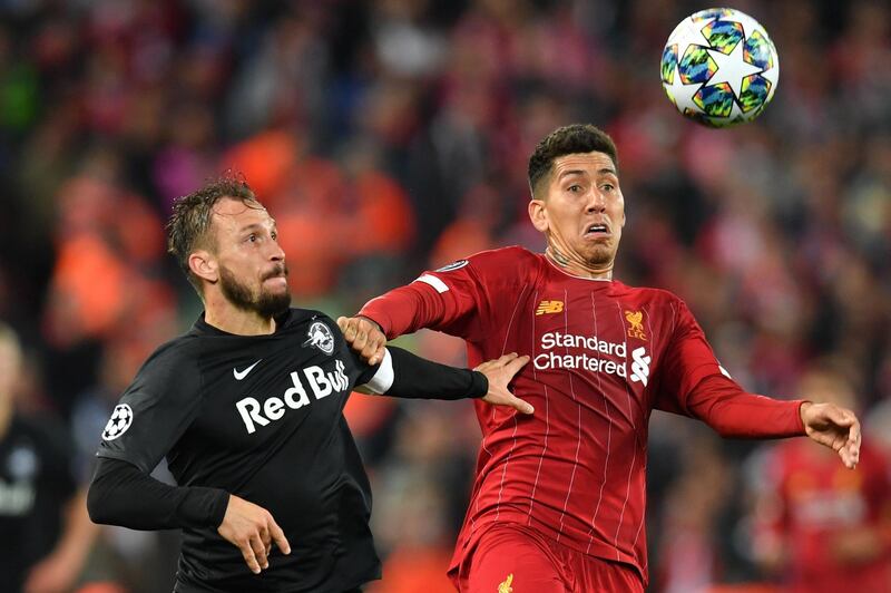 Liverpool's Roberto Firmino, right, vies with Salzburg's Andreas Ulmer. AFP