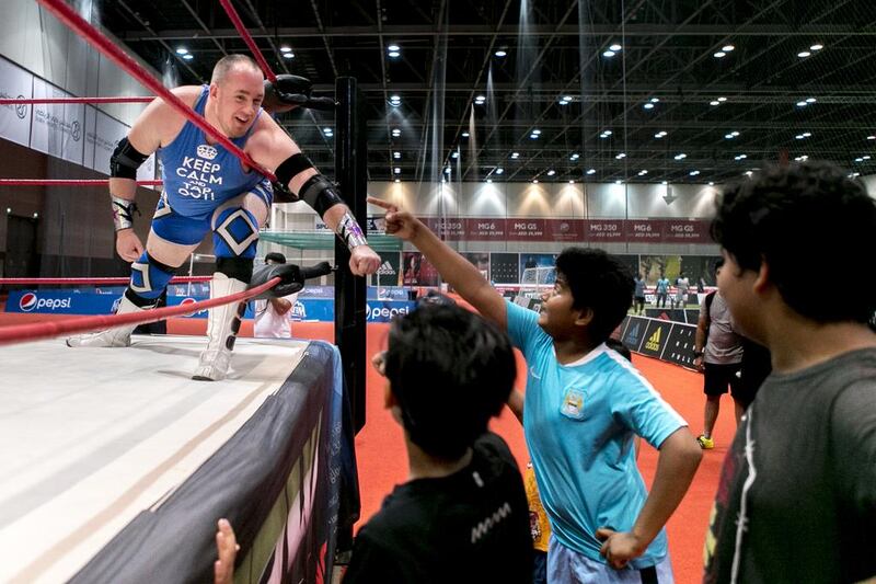 Rich 'N' Famous acknowledges young fans during a Dubai Pro Wrestling match. Reem Mohammed / The National