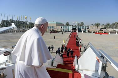 Pope Francis boards a plane to depart for Rome, at Baghdad International Airport in Baghdad, Iraq March 8, 2021. Reuters