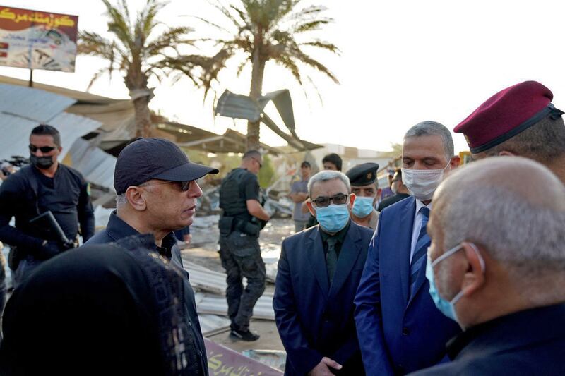 Mustafa Al Kadhimi (L), Iraq's Prime Minister, had face-to-face talks with a man suspected of killing Karbala’s mayor. AFP