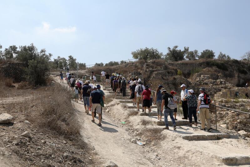 epa07048065 Israeli settlers visit an archaeological area during the Jewish holiday of Sukkot in the Palestinian village of Sabastiya near the West Bank City of Nablus, 26 September 2018. The Sukkot feast commemorates the exodus of Jews from Egypt some 3,200 years ago.  EPA/ALAA BADARNEH
