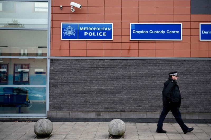 A police officer walks outside the Croydon Custody Centre in south London on September 25, 2020, following the shooting of a British police officer by a 23-year-old man being detained at the centre.  A British police officer was shot dead in the early hours of Friday morning, Scotland Yard said, the first officer to be killed by gunfire while on duty in over eight years. / AFP / DANIEL LEAL-OLIVAS
