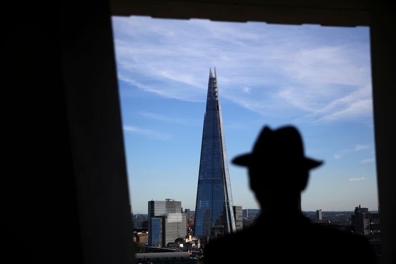 A man looks at a view of The Shard building in London, Britain October 3, 2016. REUTERS/Neil Hall  - RTSQJOV