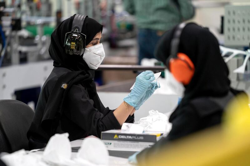 AL AIN, ABU DHABI, UNITED ARAB EMIRATES - June 24, 2020: Strata Manufacturing PJSC employees, at Al Ain International airport.

( Abdullah Al Junaibi for the Ministry of Presidential Affairs )
---