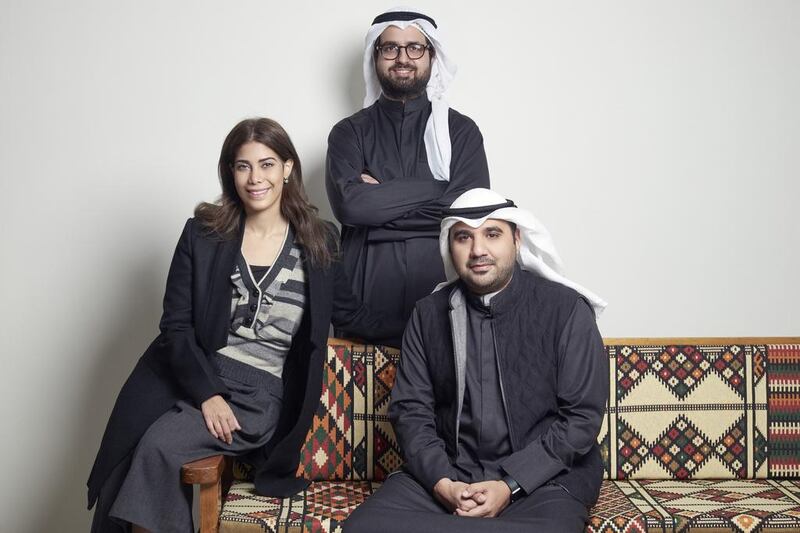 Ahmad Salamah, centre, his wife Latifa Al Sultan, and Ali Al Awadi, the co-founder of Bilbayt.com, took advantage of the trend for home catering among Kuwaitis. Courtesy Ahmad Salamah