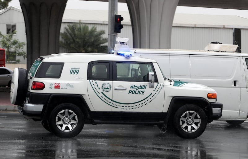 DUBAI, UNITED ARAB EMIRATES , April 15 – 2020 :- Dubai Police Patrol vehicle during the rain in Al Quoz Industrial area in Dubai.  (Pawan Singh/The National) For News/Standalone/Online/Instagram.