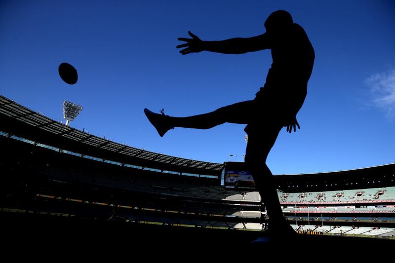 Jordan de Goey of the Magpies kicks the ball before warm up during an AFL Round match in Melbourne, Australia. Getty Images