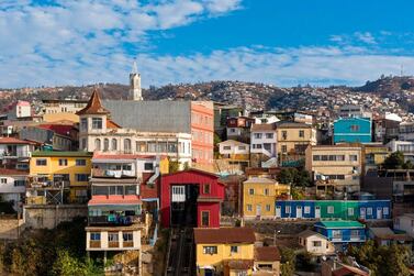 Amid the hills of Valparaiso, the city's urban elevators have been turned off meaning residents need to walk up and down the hilly terrain. AFP / MARTIN BERNETTI
