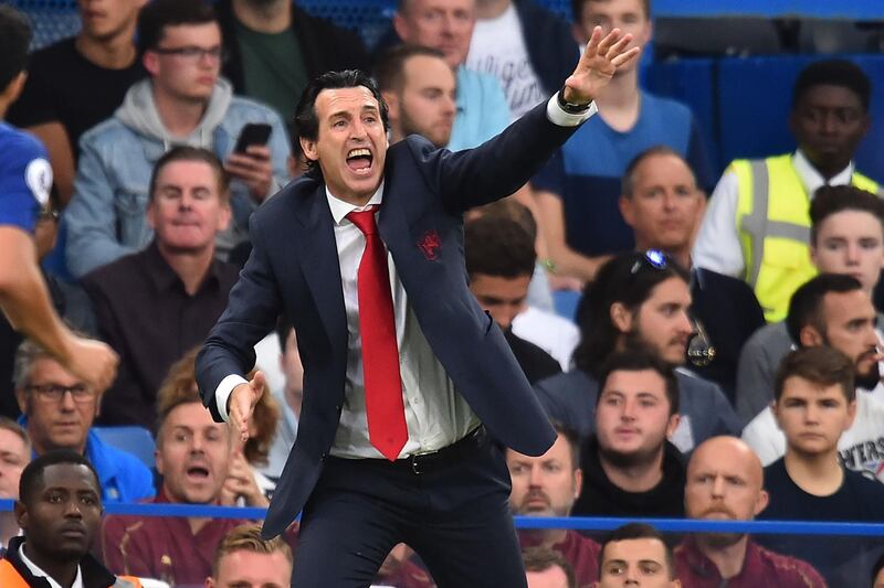 Arsenal's Spanish head coach Unai Emery gestures on the touchline during the English Premier League football match between Chelsea and Arsenal at Stamford Bridge in London on August 18, 2018. - Chelsea won the game 3-2. (Photo by Glyn KIRK / AFP) / RESTRICTED TO EDITORIAL USE. No use with unauthorized audio, video, data, fixture lists, club/league logos or 'live' services. Online in-match use limited to 120 images. An additional 40 images may be used in extra time. No video emulation. Social media in-match use limited to 120 images. An additional 40 images may be used in extra time. No use in betting publications, games or single club/league/player publications. / 