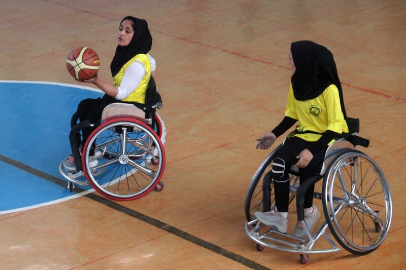 Afghan women with mobility impairment consequences of polio participate in a wheelchair basketball friendly match during part of a polio vaccination campaign in Herat on August 23.  AFP