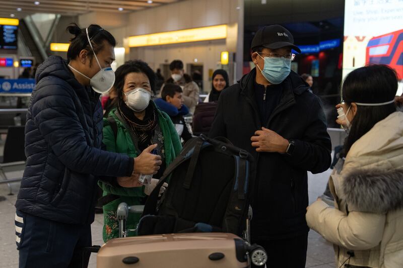 People at Heathrow Airport after arriving on a flight from Shanghai. Getty